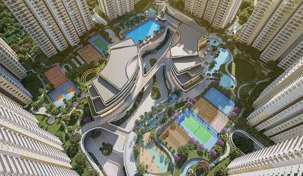 Lush green landscape within the Prestige Golden Grove project featuring walking paths, dense tree cover, and open lawns.