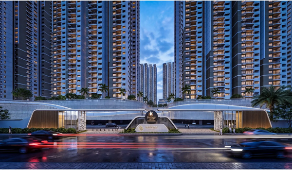 Stunning night-time view of the Prestige Golden Grove project with illuminated towers and decorative garden lighting.