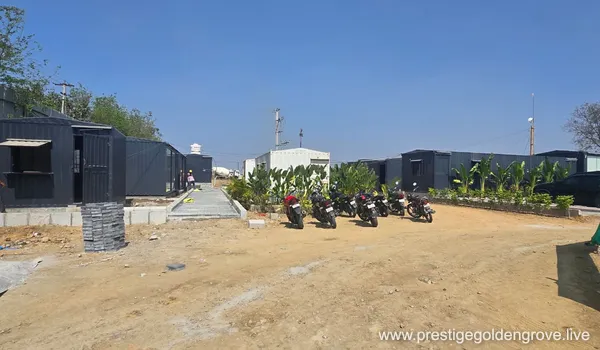 Prestige Golden Grove site office area with modular container cabins and staff parking, Velimela, Hyderabad.