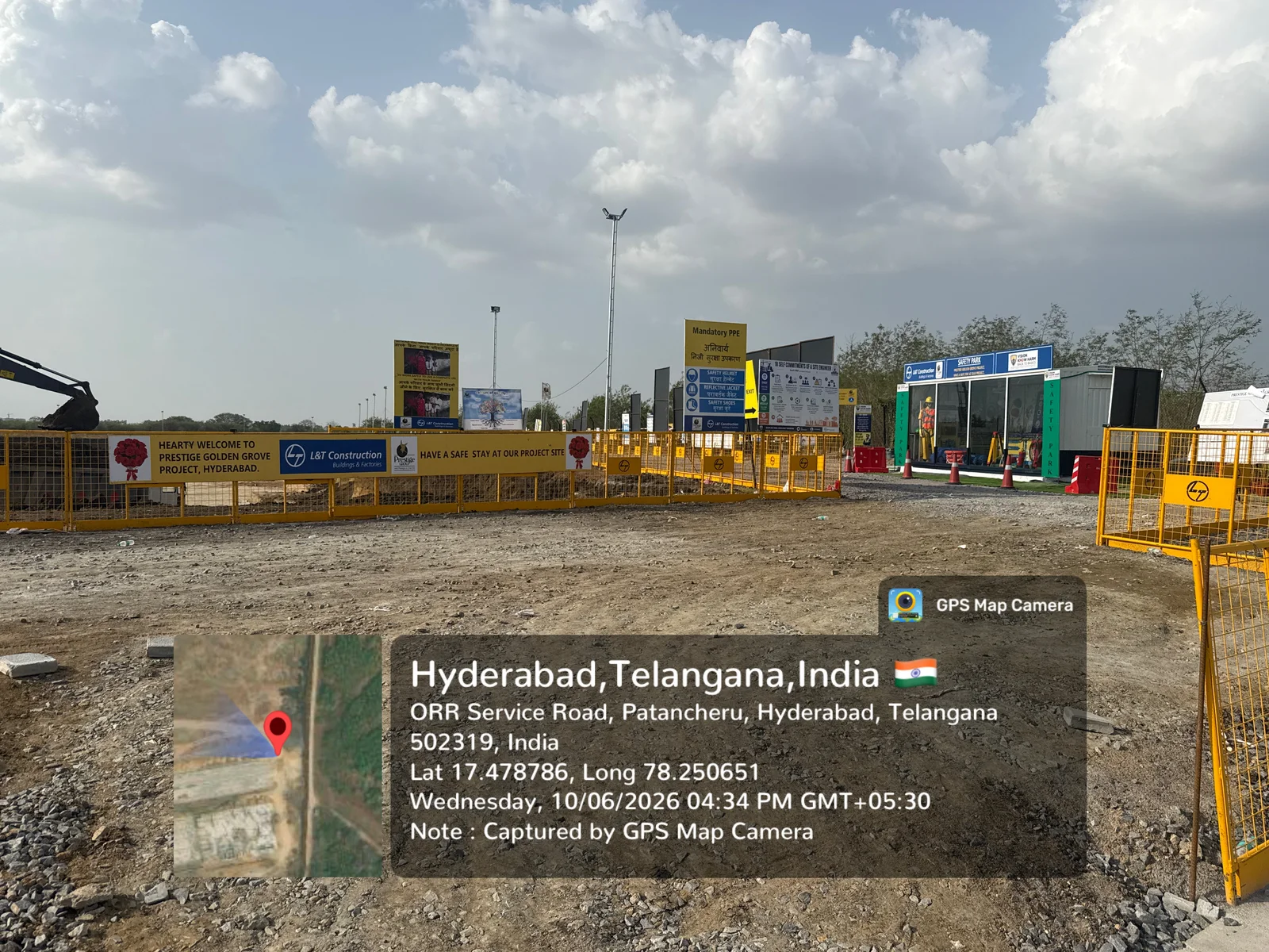 Construction entry gate at Prestige Golden Grove, Velimela, with the L&T Construction welcome and safety boards, June 2026.